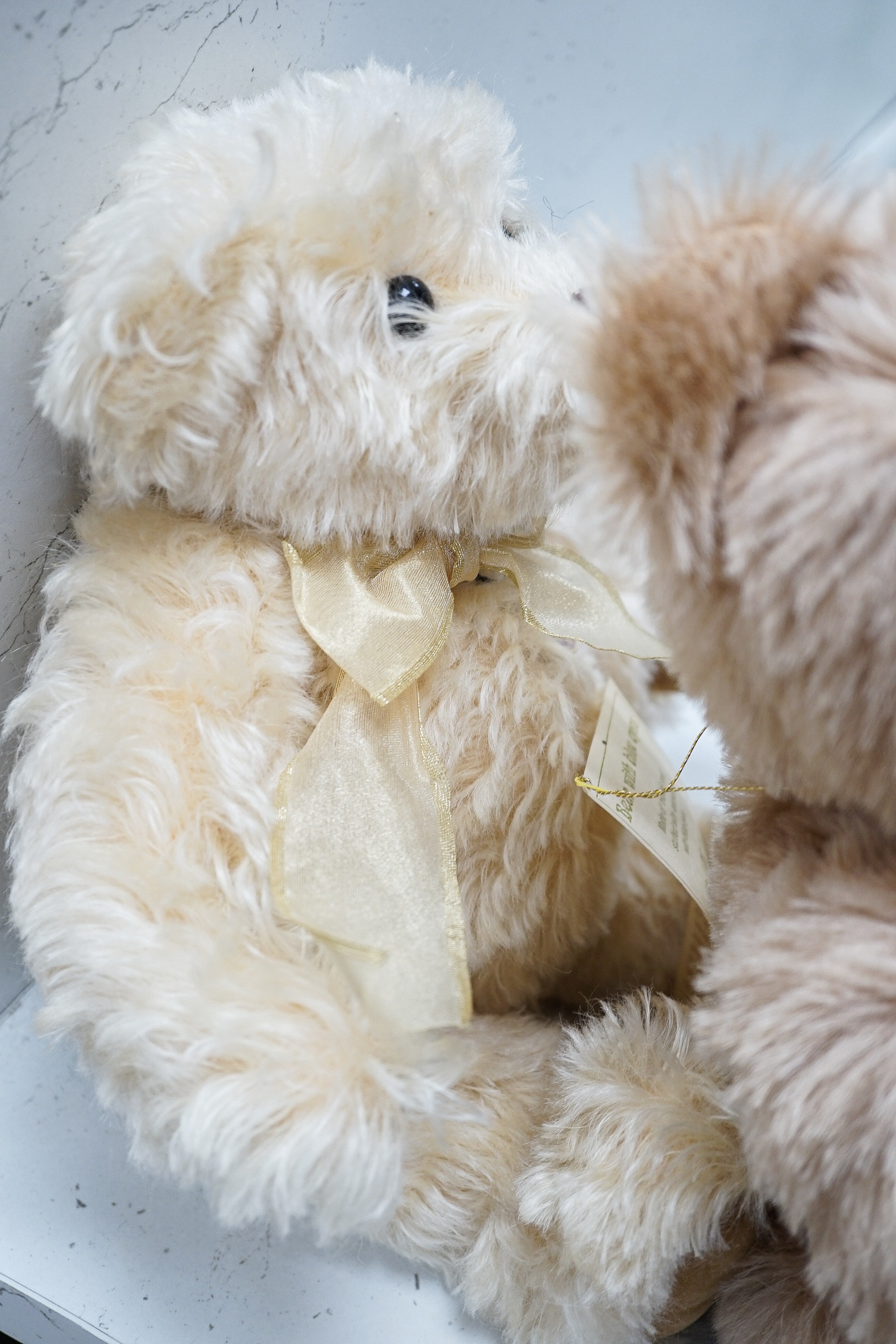 Four Deans teddy bears, a Steiff teddy and a Hermann teddy, Steiff bear, 39 cms high.